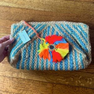Brand new Franchescas woven clutch
